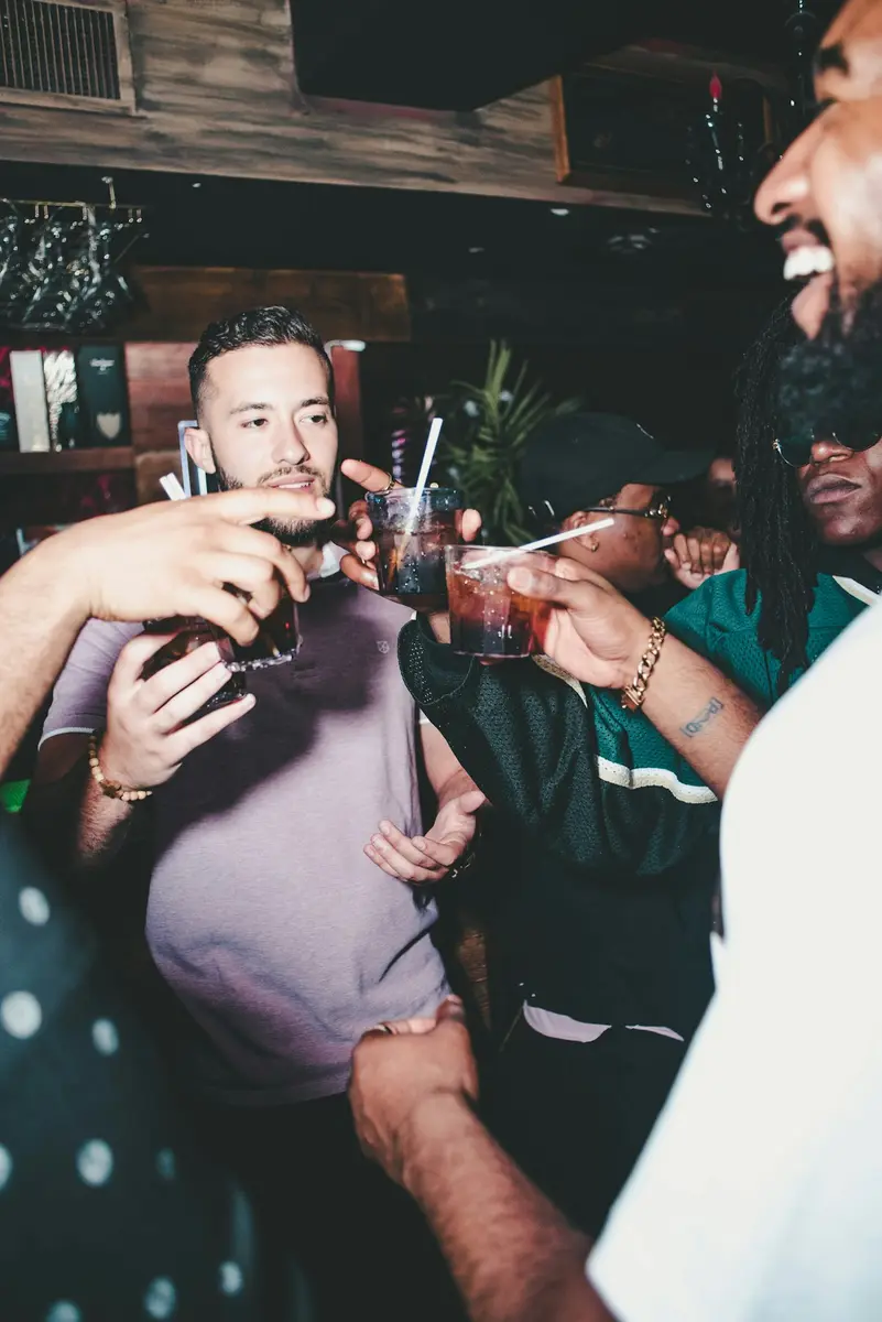 Friends laughing at a bar