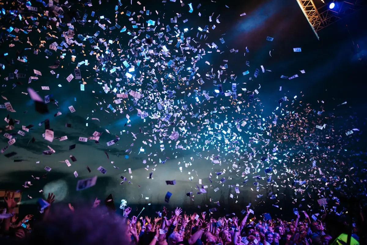 Confetti falling over a crowd at night