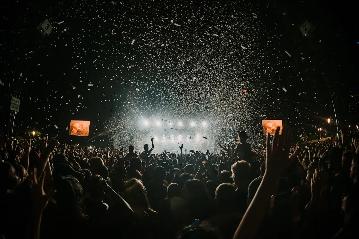 Confetti over a festival crowd at night